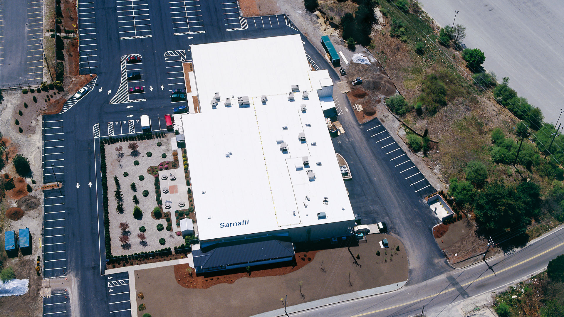 Aerial View of Large Industrial Facility and Parking Lot