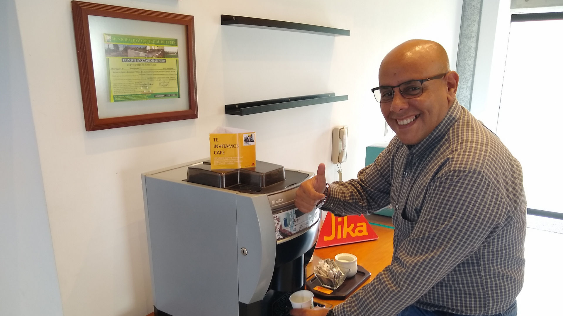 Man Using Coffee Machine in Office Setting