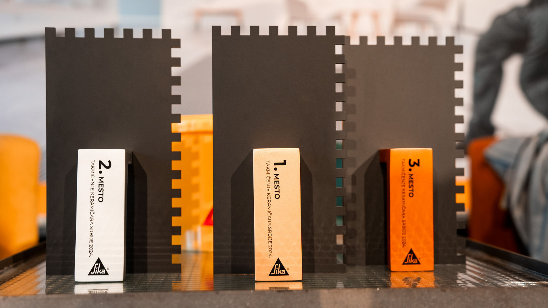 Modern Award Trophies Displayed on Table Indoors