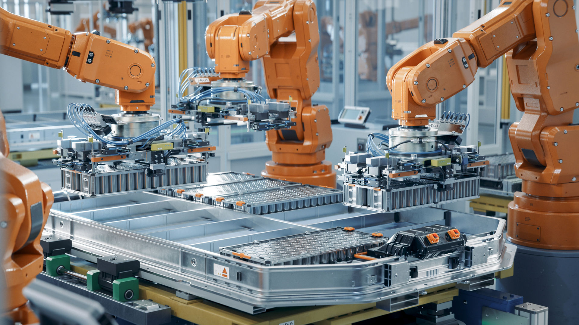 Robots working on battery packs assembly line