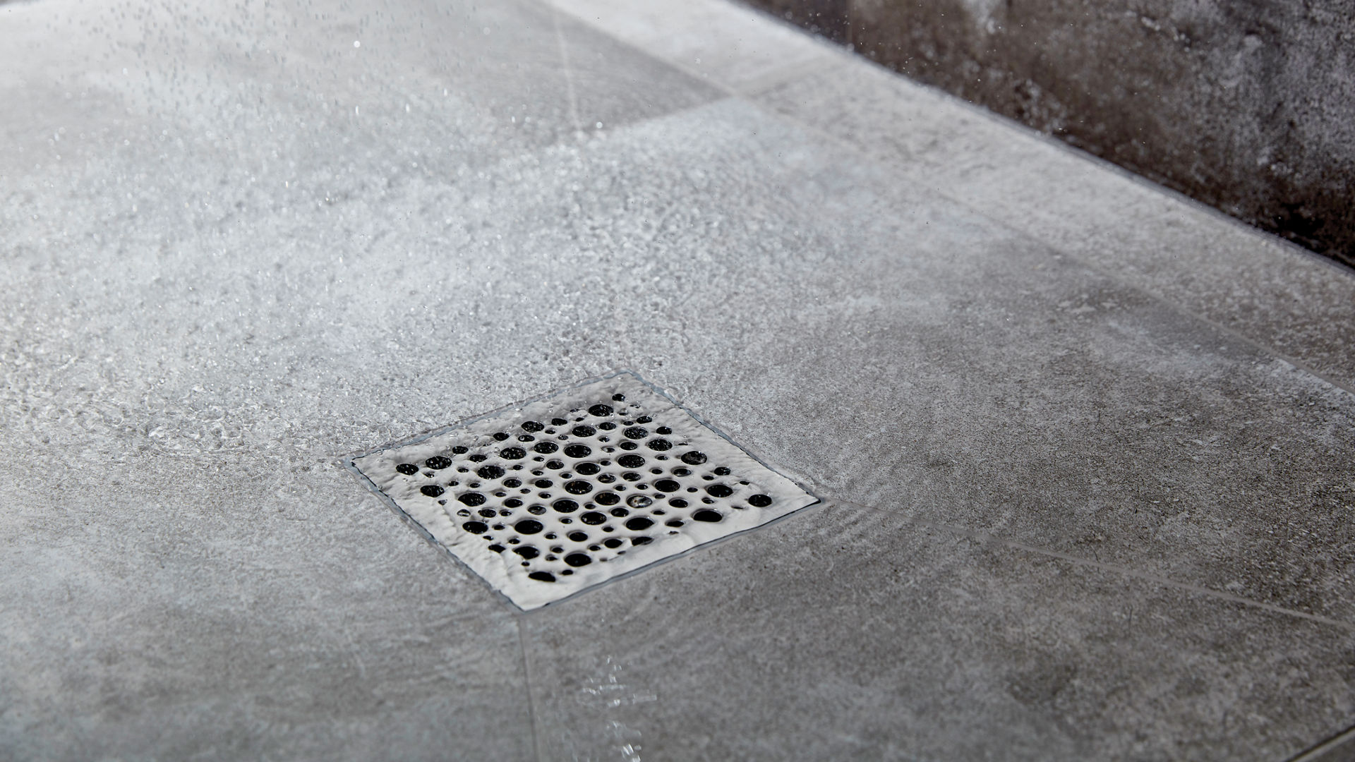 Man applying Aquaseal wet room system tanking kit
