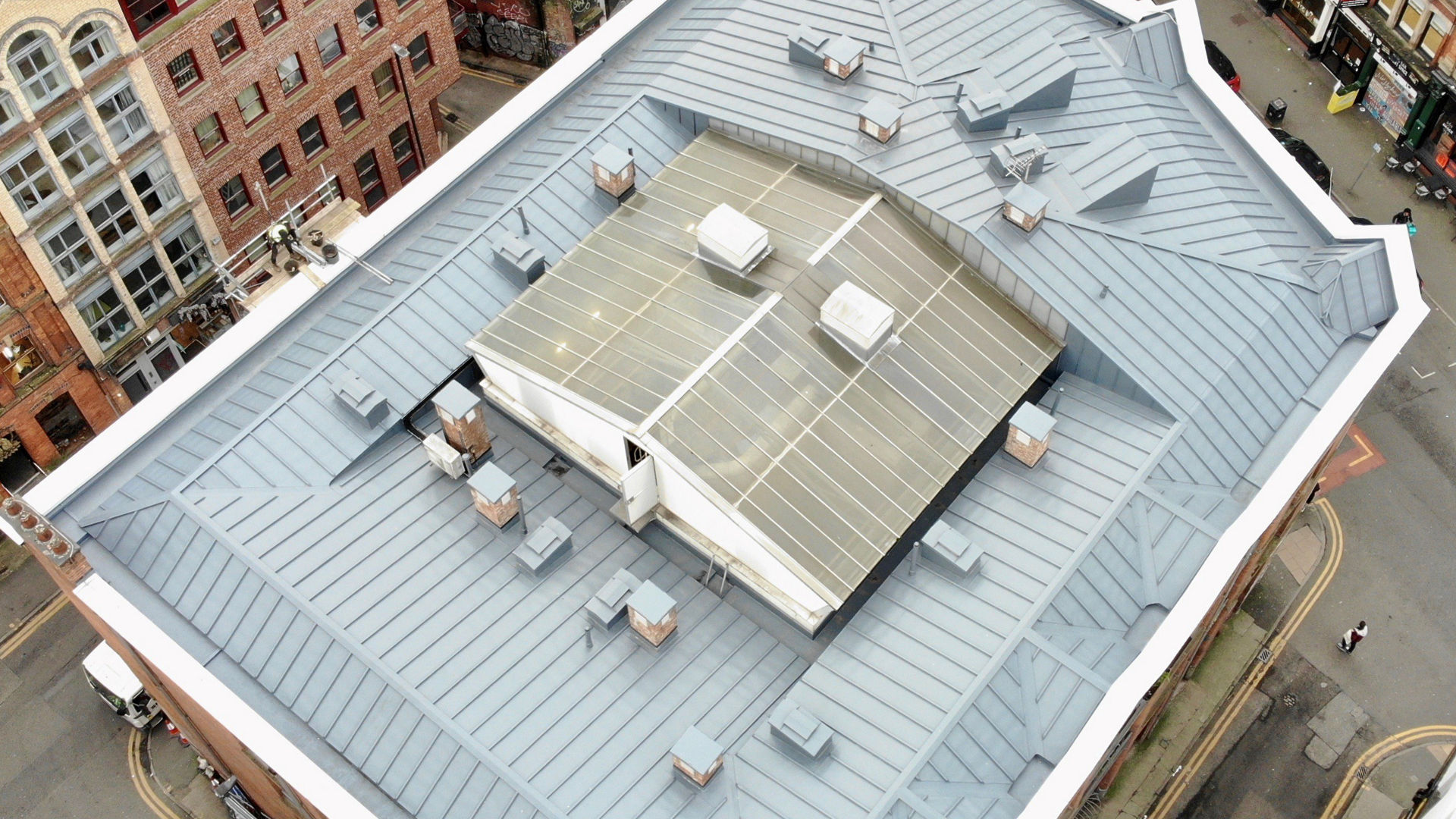 Aerial view of modern metal rooftop in city