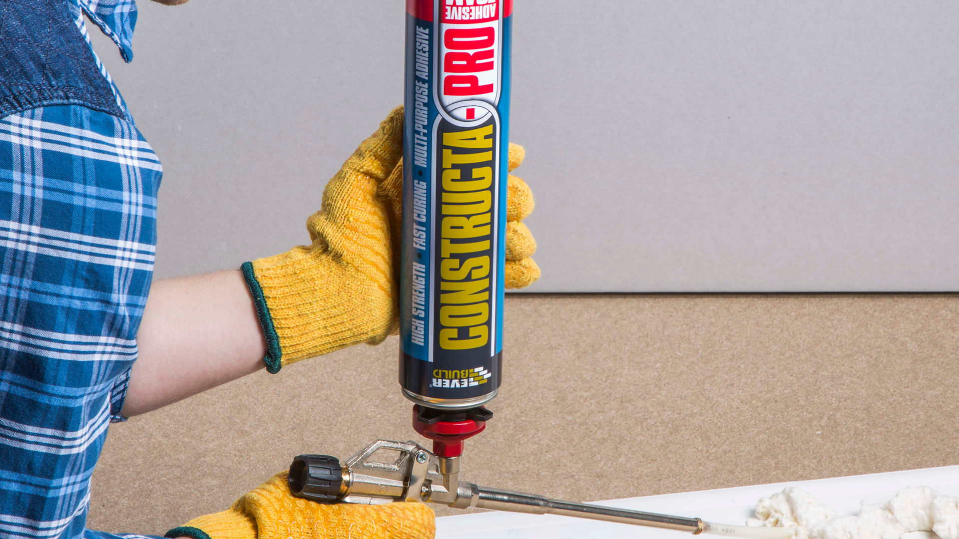 Person applying Constructa Pro adhesive foam