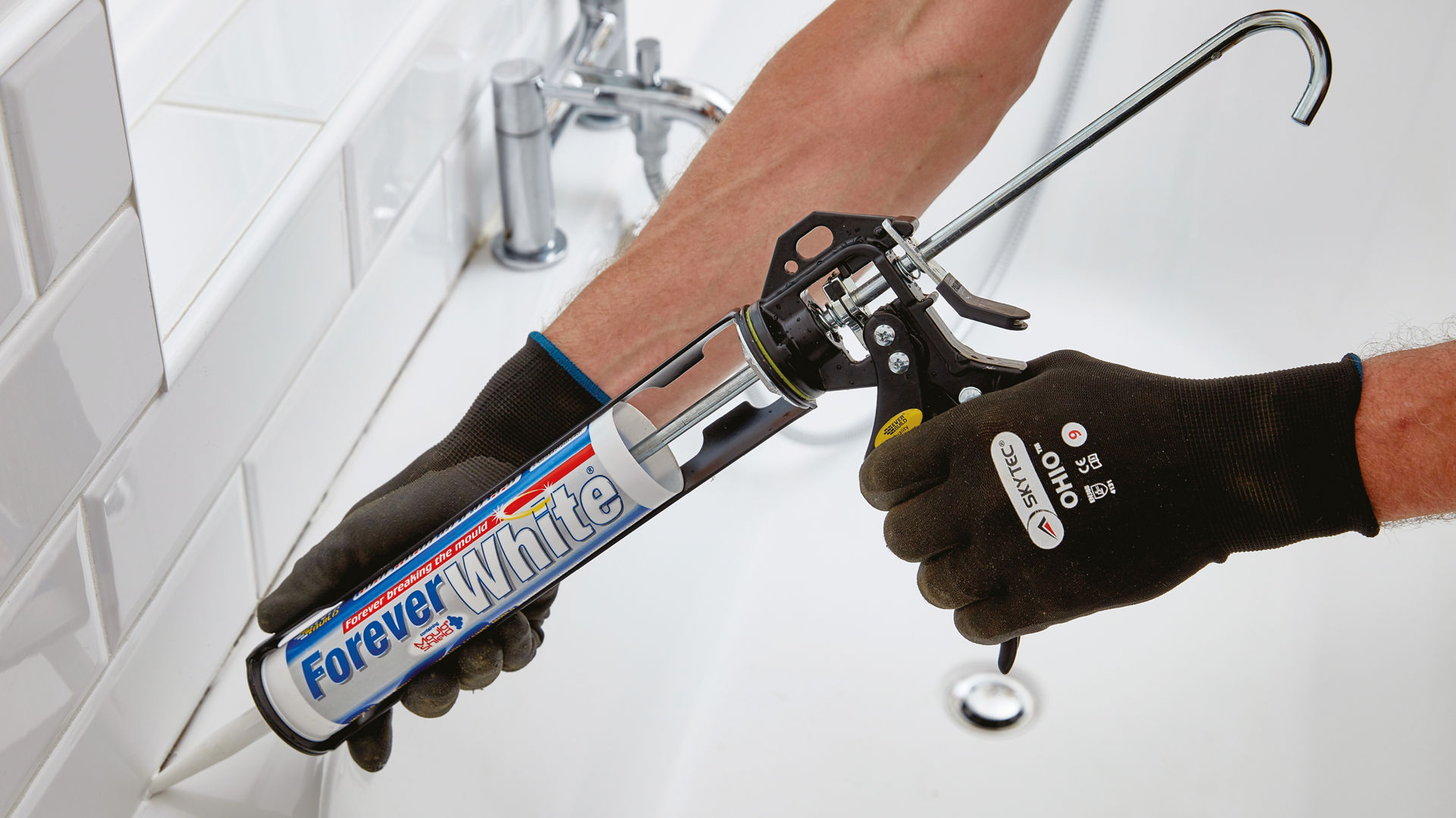 Forever White sealant being applied around a bath