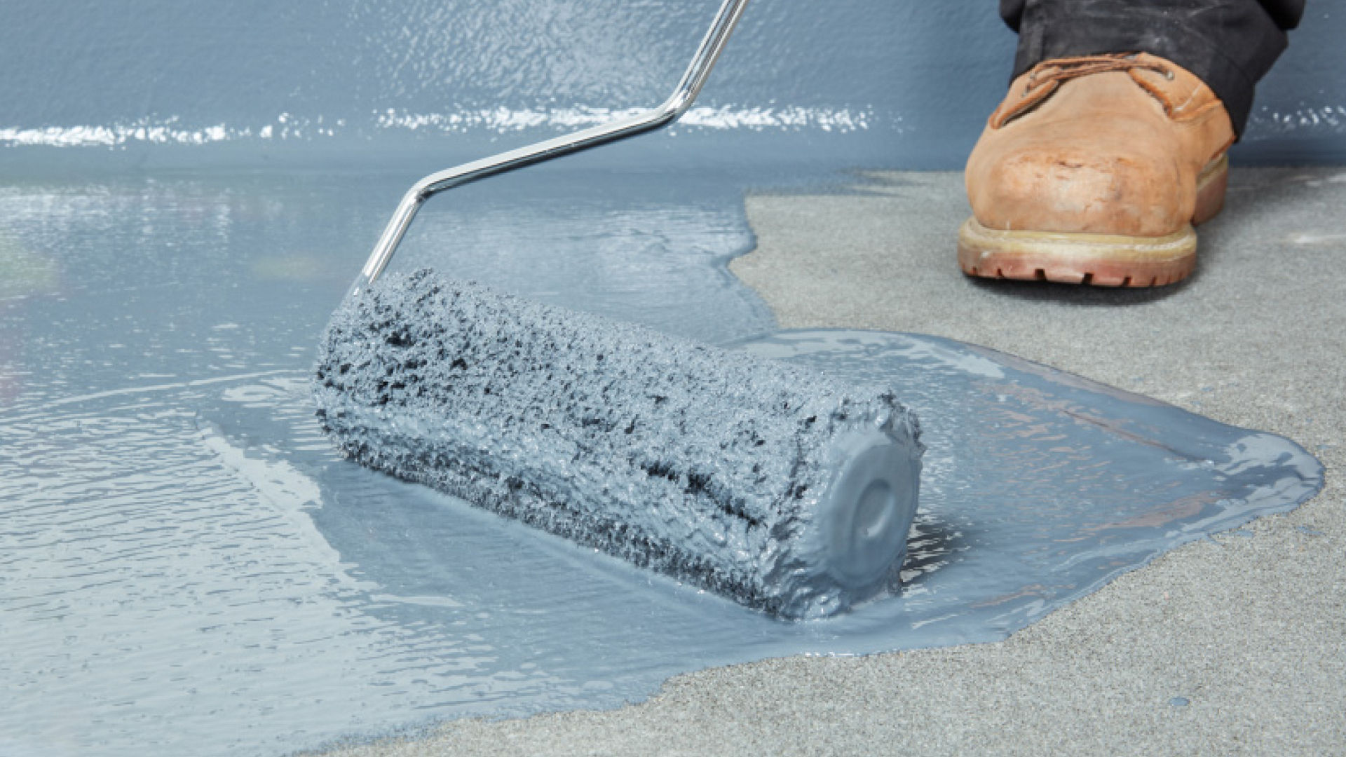 Person applying Liquid Roof