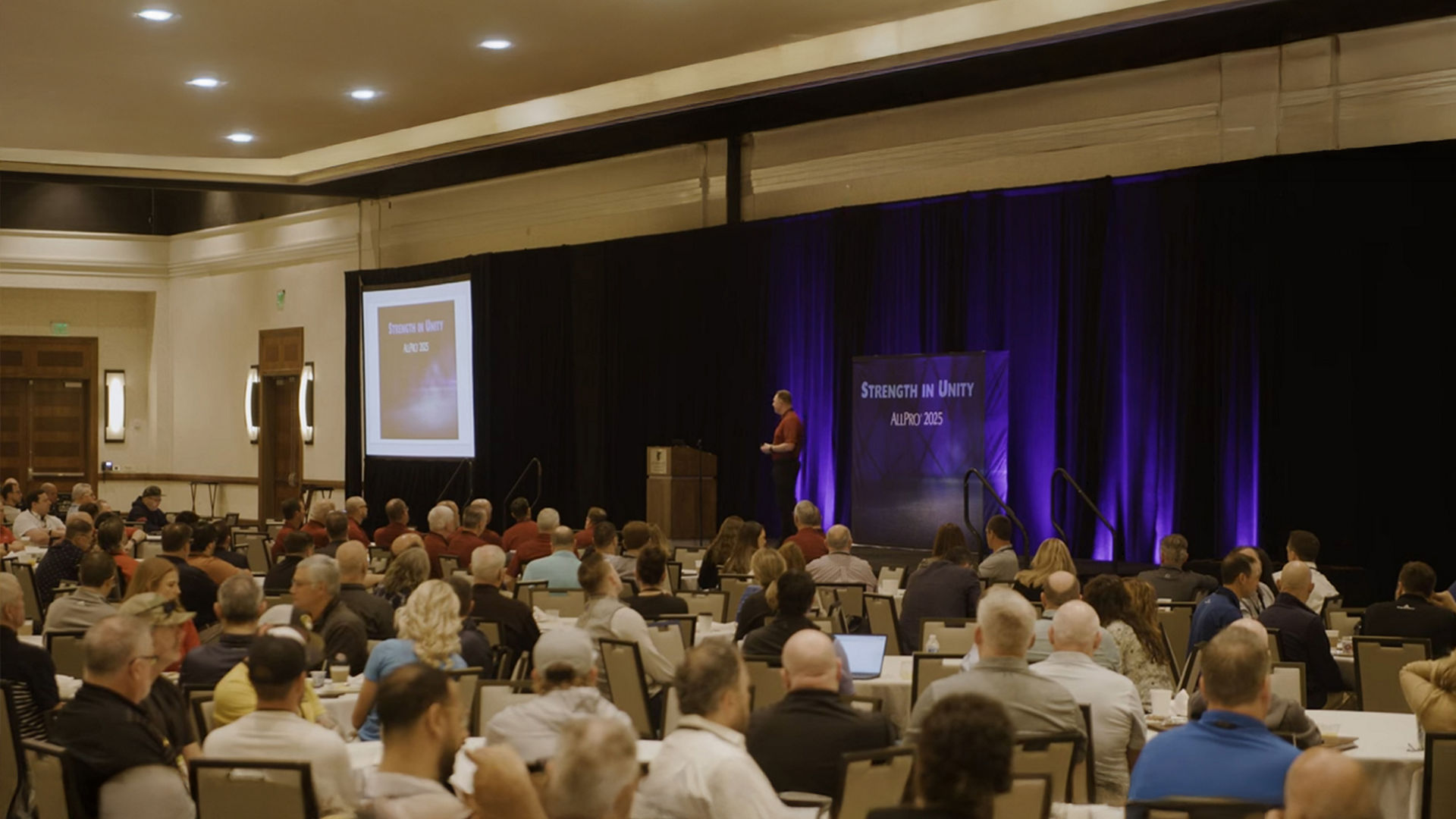 Conference audience with speaker on stage