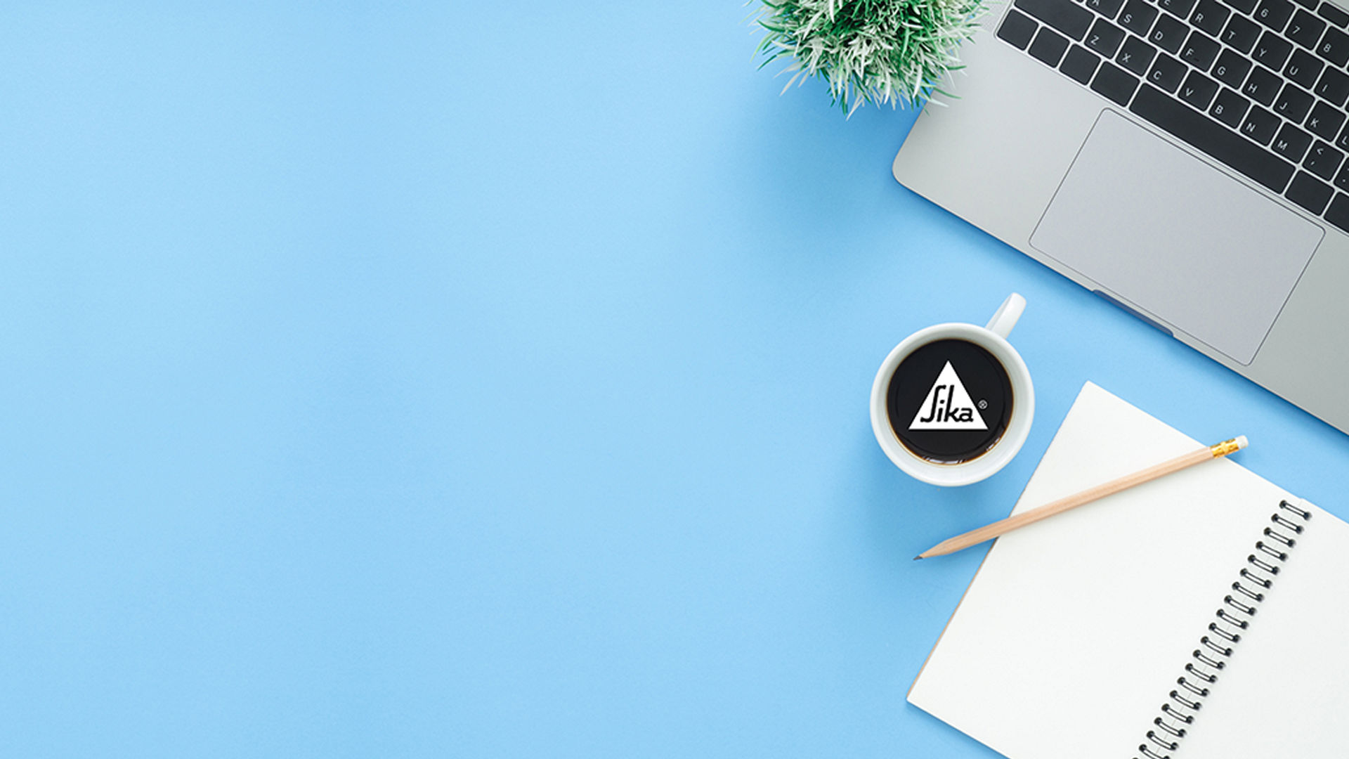 Workspace essentials with laptop and coffee