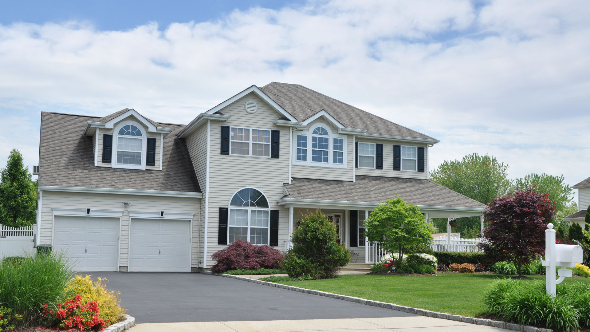 Modern suburban house with landscaped yard
