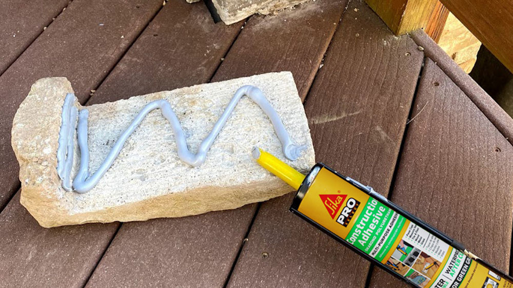 sikabond-construction-adhesive-application-on-stone-surface-outdoors