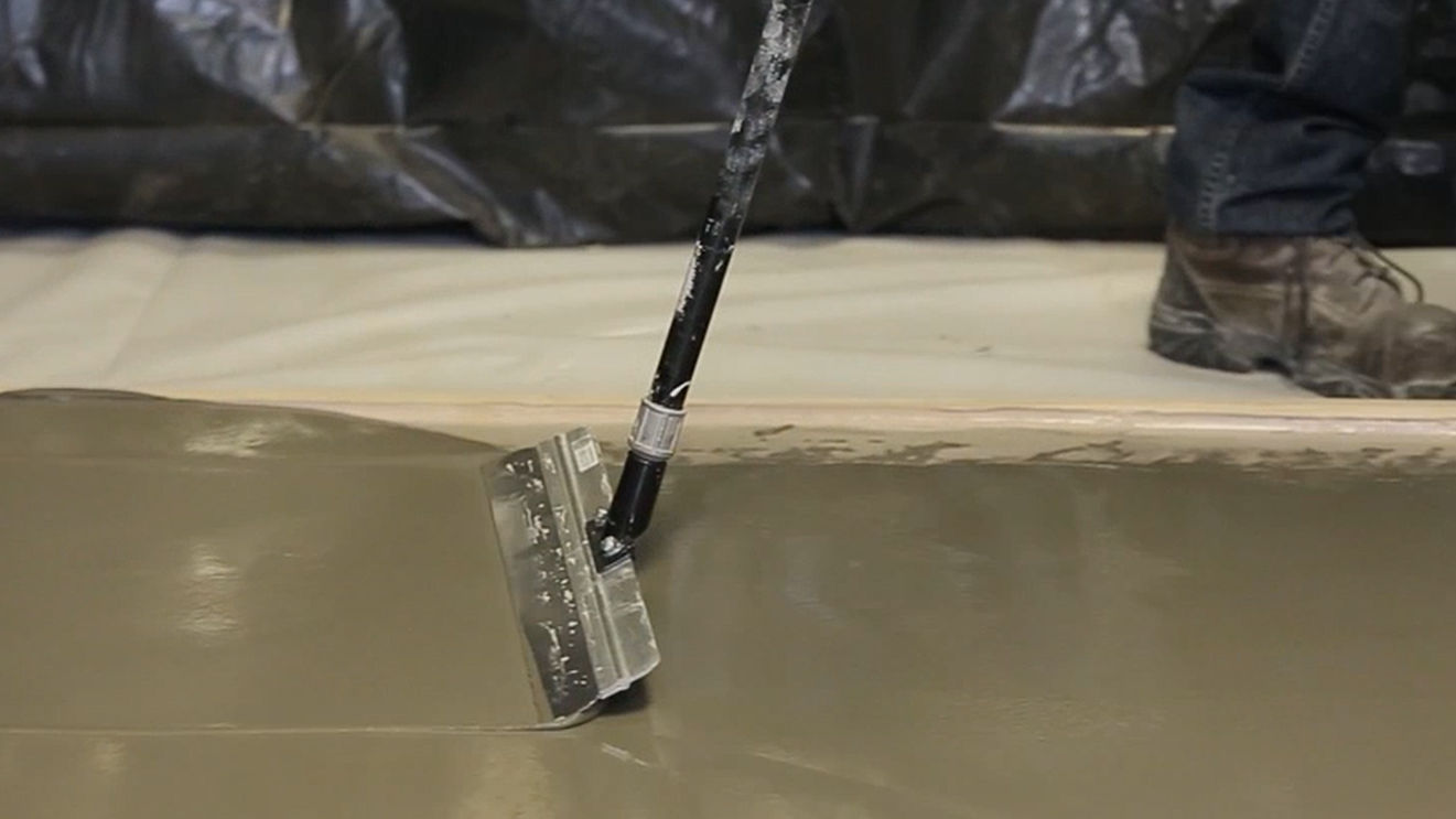 Concrete leveling tool in construction setting