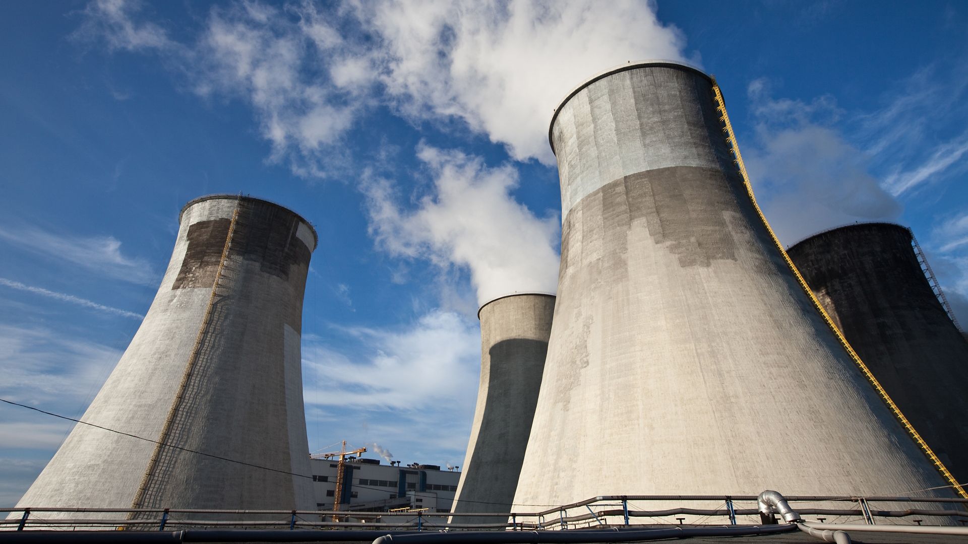Cooling tower with concrete repair and blue sky