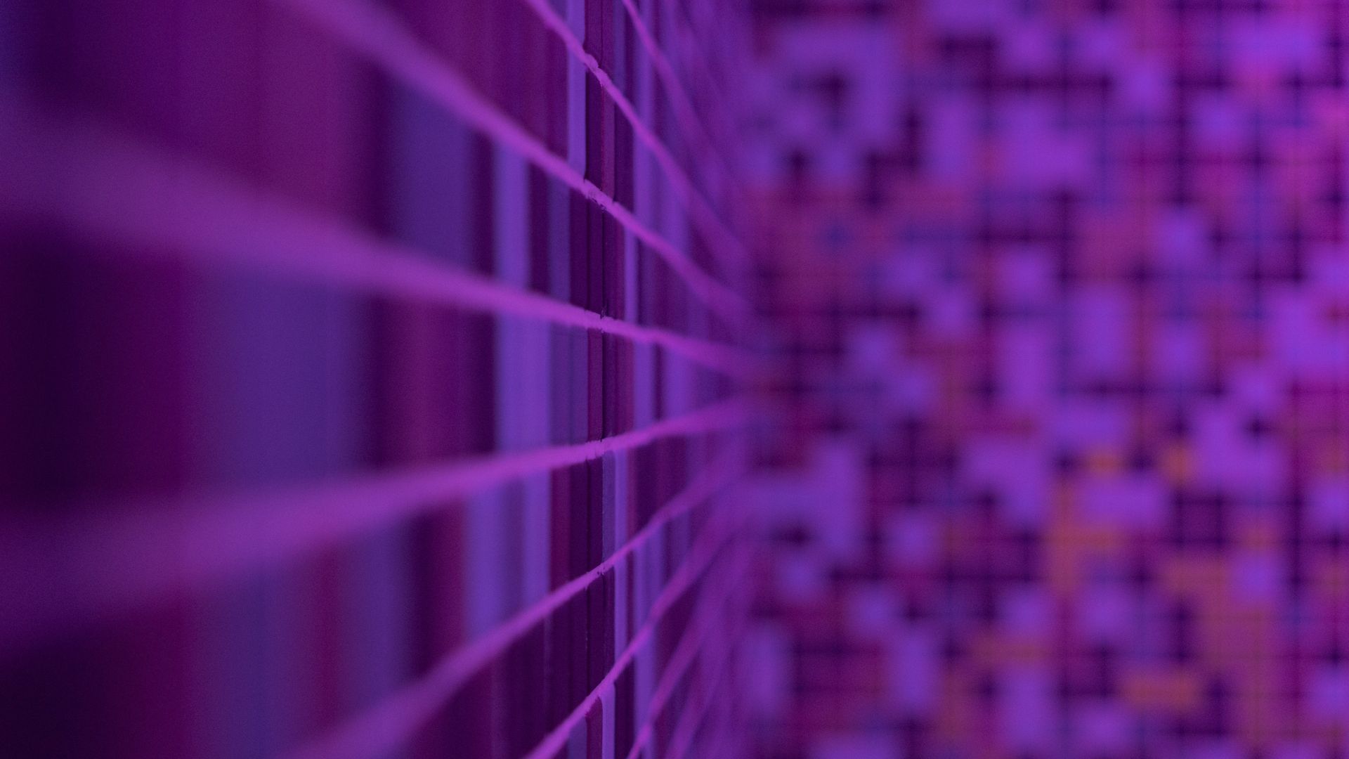 Close up view of mosaic purple tiles with grout in shower